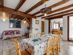 a large living room with a table and chairs at Chalet in Montagny near Ski Slopes in Montagny