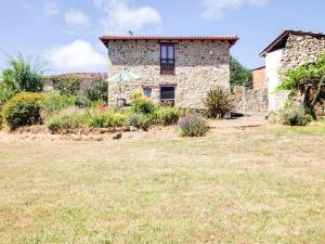 an old stone house with a garden in front of it at Traditional Apartment in Ribeira Sacra with Garden in Castillón +46 photos