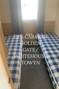 Voodi või voodid majutusasutuse Dps golden gates caravan toas