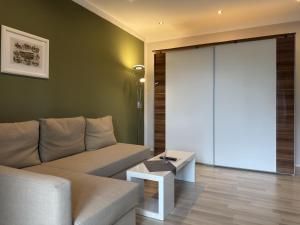 a living room with a couch and a table at Appartementhaus in Drei Annen Hohne in Drei Annen Hohne +31 photos