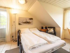 Ένα ή περισσότερα κρεβάτια σε δωμάτιο στο Apartment in Friedrichskoog-Spitze with parking space