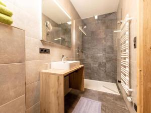 a bathroom with a sink and a shower at Apartment in Strass im Zillertal in a beautiful setting in Strass im Zillertal