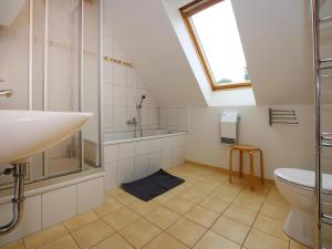 a bathroom with a sink and a shower and a toilet at Holiday resort in the Müritz National Park, Mirow in Mirow