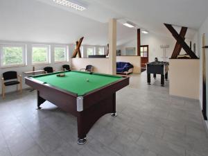 a large room with a pool table in it at Holiday resort in the Müritz National Park, Mirow in Mirow