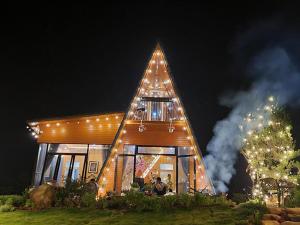 a large tree shaped house with a christmas tree at WindHill Homestay Bảo Lộc - Căn Bungalow Lux in Bon Tan Djiran B +5 photos