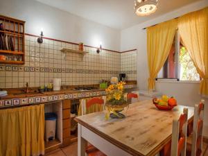 a kitchen with a table with a bowl of fruit on it at Holiday home in Malpais de Candelaria with a terrace in Bence