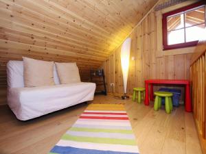 a room with a bed in a wooden cabin at Blockhaus mit Sauna und Kamin in Schierke in Schierke