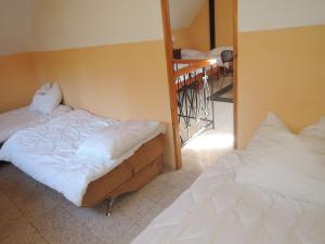 two beds in a room with a stair case at Holiday appartment, Sulomino 100 qm, 2 rooms, 4 persons, type C in Sułomino