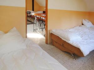 a bedroom with two twin beds and a staircase at Holiday appartment, Sulomino 100 qm, 2 rooms, 4 persons, type C in Sułomino +40 photos