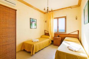 Katil atau katil-katil dalam bilik di Apartment Triscina Mare in Castelvetrano