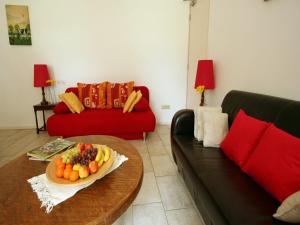 a living room with a table with a plate of fruit at Wijlre Farmhouse stay in Wijlre +26 photos