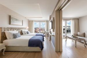 a bedroom with a large bed and a large window at CVK Taksim Hotel Istanbul in Istanbul