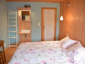 a small bedroom with a bed and a sink at Cozy Farmhouse Near Houffalize in Halonreux +19 photos