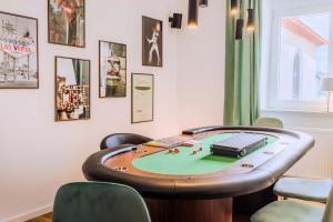 a table with a poker table in a room at Villa Klosterschenke Sauna Whirlpool Game Room in Sankt Goarshausen