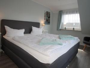 Ένα ή περισσότερα κρεβάτια σε δωμάτιο στο Apartment in Berumbur +17 φωτογραφίες