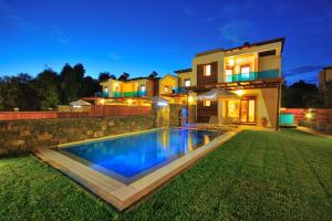 a house with a swimming pool in the yard at Holiday home in Kiotari near the beach in Kiotari
