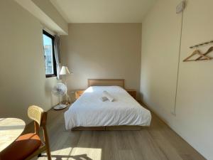 Postel nebo postele na pokoji v ubytování Hello Guesthouse