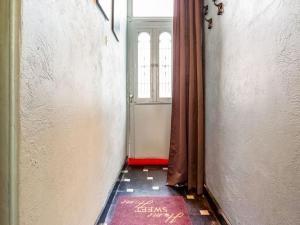 an empty hallway with a door and a window at Spacious holiday home in Bruges in Bruges