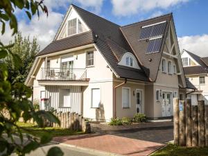 a house with solar panels on the roof at Apartment, Zingst in Zingst