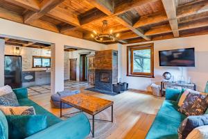 a living room with a couch and a fireplace at Imperial Apartments - Villa Koleczkowo in Koleczkowo
