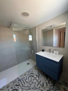 a bathroom with a sink and a shower at A de Laura in Lariño +5 photos