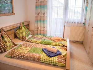 Postel nebo postele na pokoji v ubytování Rauchenbacher Apartments, Mittersill