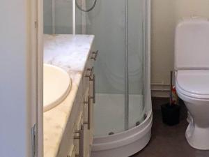 a bathroom with a shower and a sink and a toilet at 7 person holiday home in Skutvik in Skutvika +42 photos