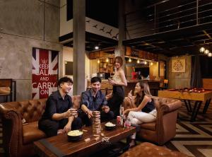 a group of people sitting in a room at The Canale Hat Yai in Songkhla
