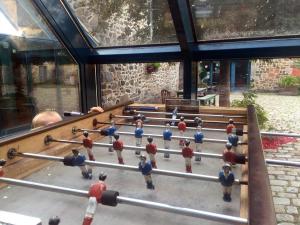 a group of men playing a game of snooker at Auberge de Jeunesse HI Saint-Brieuc in Saint-Brieuc