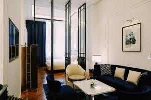 a living room with a couch and a table at Yangon Excelsior in Yangon