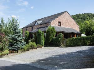 a large brick house with a gravel driveway at Atmospheric holiday home in Durbuy with sauna in Septon +48 photos