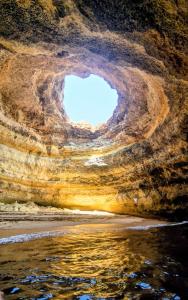 a view from inside of a cave with the sky at Linda Vista Mar T1, A-C, Wi-Fi, Porches in Porches