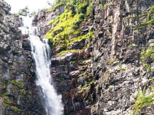 a waterfall on the side of a cliff at 12 person holiday home in IDRE in Idre