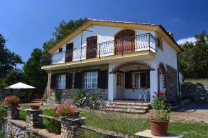a house with a balcony on top of it at Agriturismo il Roccolo in Pantasina