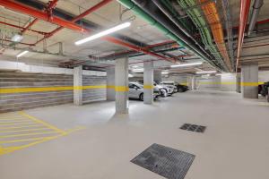 an empty parking garage with cars parked in it at B&B HOTEL Porto Centro Massarelos in Porto
