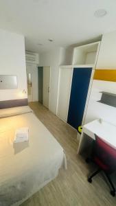 a room with a bed and a desk and a chair at Residencia Universitaria Tagaste Madrid in Madrid