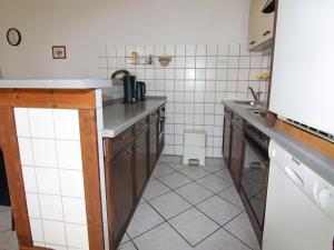 a kitchen with a sink and a counter top at Ferienwohnung im Gutshaus Schulenbrook in Metelsdorf +32 photos