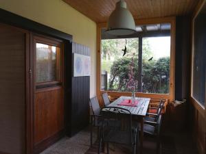a dining room with a table and chairs and a window at Wohnung in Tauplitz nahe Skilift in Tauplitz