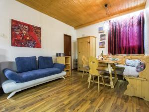 a living room with a couch and a table at Wohnung in Tauplitz nahe Skilift in Tauplitz