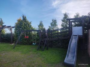 Ο χώρος παιχνιδιού για παιδιά στο Comfortable holiday homes, swimming pool, Rewal