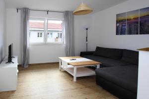 a living room with a couch and a coffee table at Reihenhaus in Malchow in Malchow