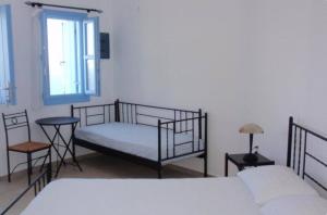 Postel nebo postele na pokoji v ubytování Villa Kalamiotissa