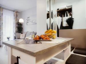 a kitchen counter with a plate of fruit on it at Comfortable apartment close to the sea, Pobierowo in Pobierowo