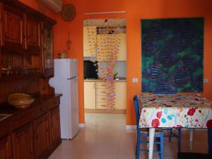 Η κουζίνα ή μικρή κουζίνα στο Apartments Costa Rei