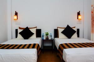 Ένα ή περισσότερα κρεβάτια σε δωμάτιο στο L&D Lodge