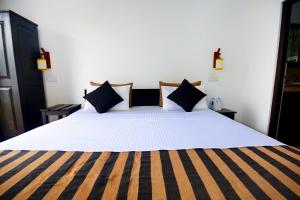 Ένα ή περισσότερα κρεβάτια σε δωμάτιο στο L&D Lodge