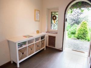 a room with a white cabinet and an open door at Mansion in Spa Liege with private garden in Spa +32 photos