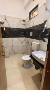 a bathroom with a toilet and a sink at The Boho Udaipur in Udaipur
