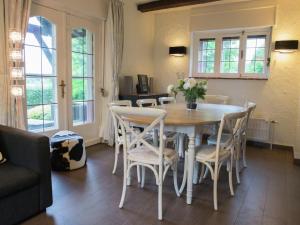 a dining room with a table and chairs at Mansion in Spa Liege with private garden in Spa