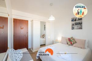 Ένα ή περισσότερα κρεβάτια σε δωμάτιο στο #012 Exclusivo para Famílias, Habijovem by Home Holidays